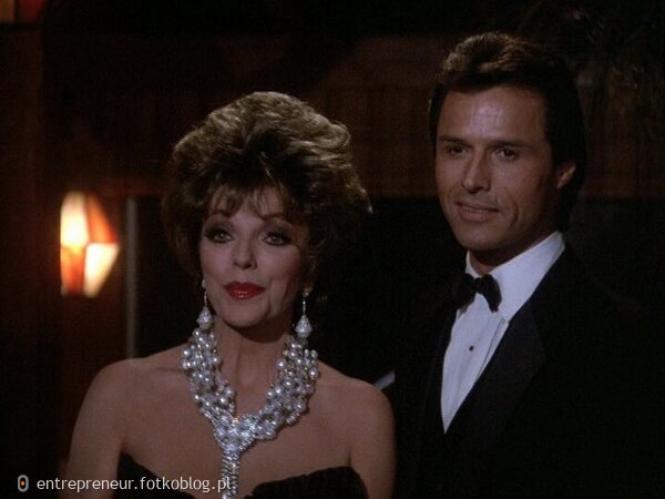 Joan Collins as Alexis and Dex II