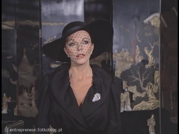 Joan Collins as Alexis 49