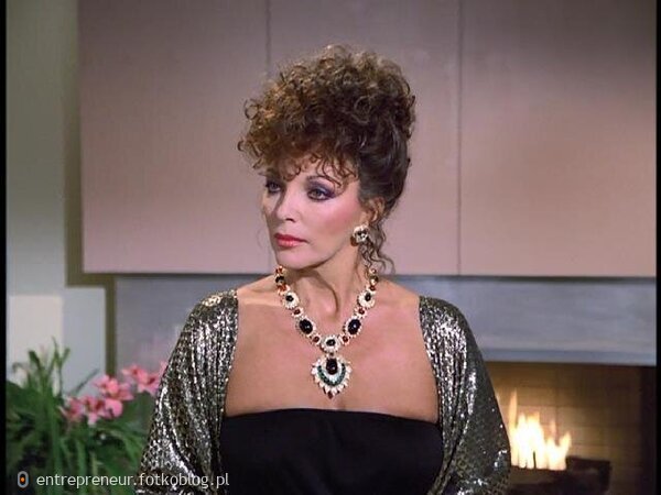 Joan Collins as Alexis 50