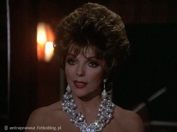 Joan Collins as Alexis 52